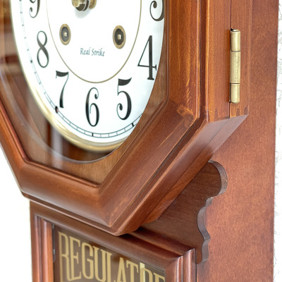 Đồng hồ treo tường Nhật Bản Rhythm CMJ586NR06 dùng pin, kích thước 24.0 x 54.0 x 11.7cm, vỏ gỗ, điểm giờ bằng gong.