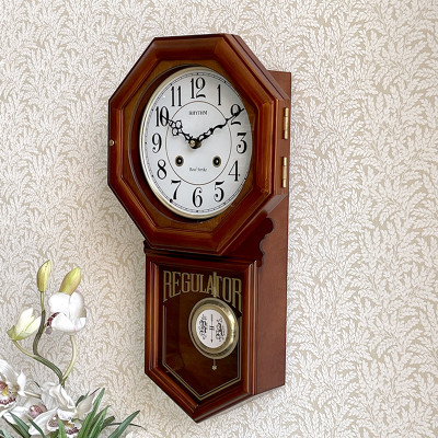 Đồng hồ treo tường Nhật Bản Rhythm CMJ586NR06 dùng pin, kích thước 24.0 x 54.0 x 11.7cm, vỏ gỗ, điểm giờ bằng gong.